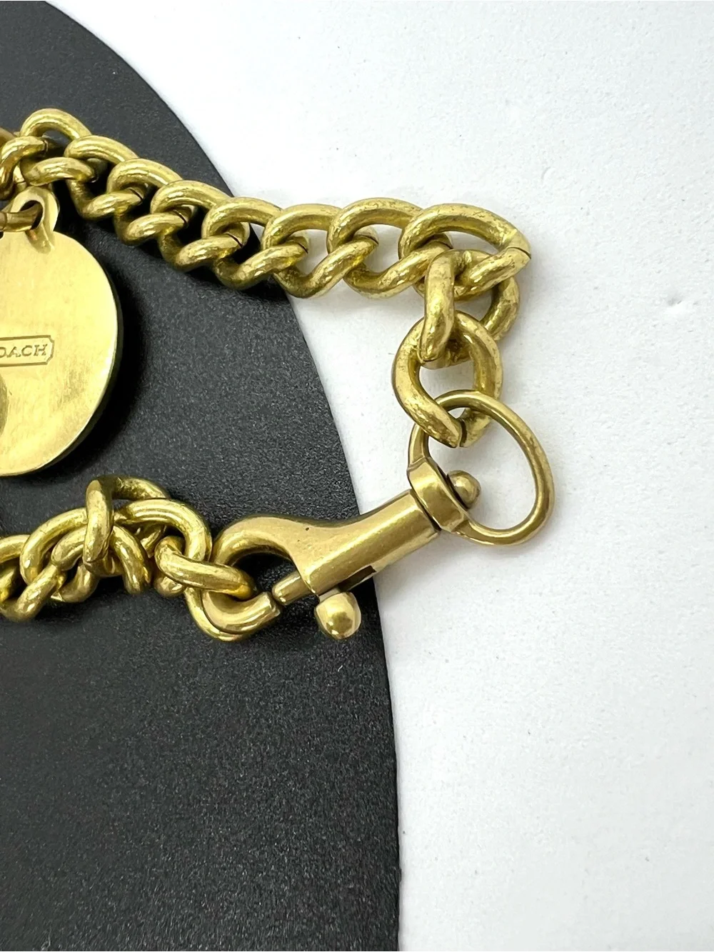Coach Gold Tone Charm Bracelet with Carriage Charms